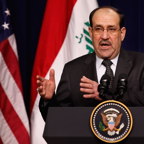 Iraqi Prime Minister Nouri Al-Maliki answers reporters' questions during a news conference with US President Barack Obama in the Eisenhower Executive Office Building on Dec. 12, 2011, in Washington.