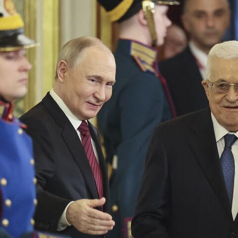 Russia's President Vladimir Putin (L) and Palestinian Authority President Mahmud Abbas (R) arrive for their talks in Moscow on May 10, 2025.
