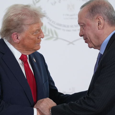US President Donald Trump greets Turkey's President Recep Tayyip Erdogan during a world leaders' summit on ending the Gaza war on Oct. 13, 2025 in Sharm El-Sheikh, Egypt.  