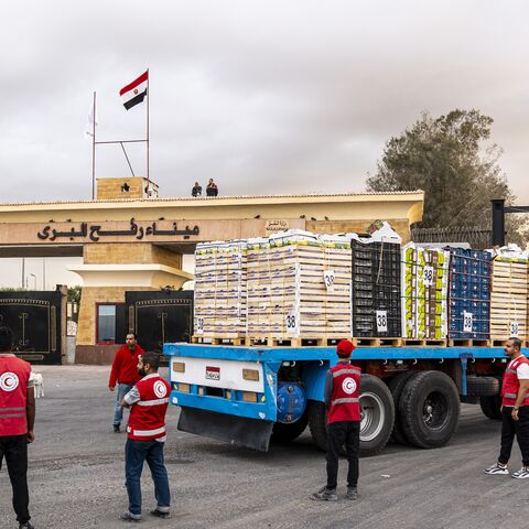 Truck carrying aid enters Gaza through the border crossing on Oct. 12, 2025, in Rafah, Egypt. 
