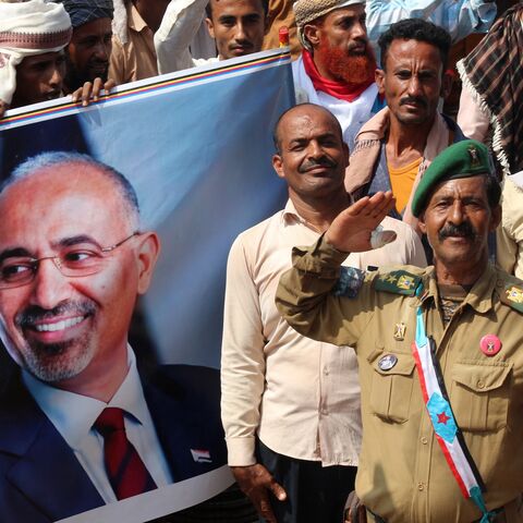 Yemeni members of the Sabahiha tribes of Lahj, who live along the strip between the south and north of the country and who support the UAE-backed Southern Transitional Council (STC), hold an image of the STC leader Aidaros Alzubidi. 