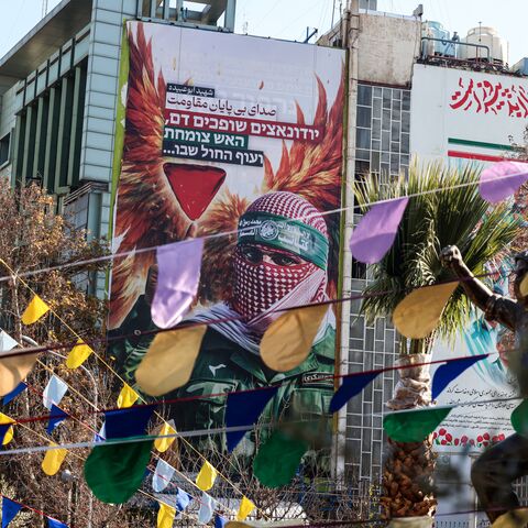 A large anti-Israeli banner portraying an image of a Palestinian fighter and the slogan in Persian and Hebrew, "Endless Voice of Resistance" is erected in Palestine Square in Tehran on Dec. 31, 2025. 