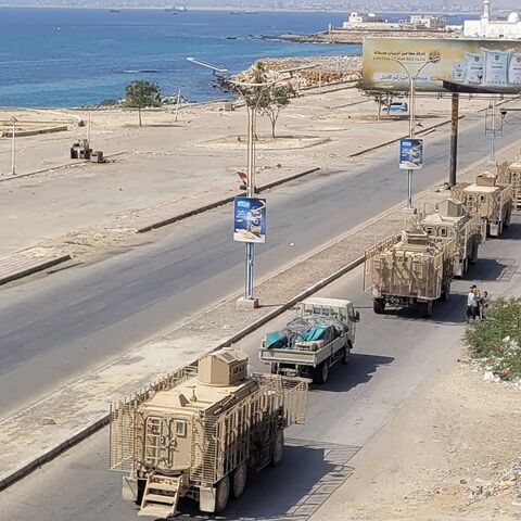A convoy of armored vehicles makes its way along a street in the port city Mukalla, southern Yemen, on Jan. 1, 2026.