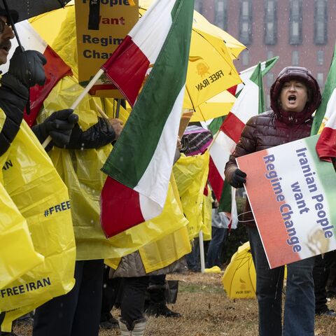 Sadaf Ebrahimi walks down a row of demonstrators at Lafayette Park in front of the White House during the "Free Iran" rally on Jan 10, 2026, in Washington. 