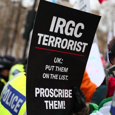 A person holds up a placard which reads "IRGC Terrorist" as they take part in a rally in solidarity with protesters in Iran on Jan. 11, 2026, in London, England. 