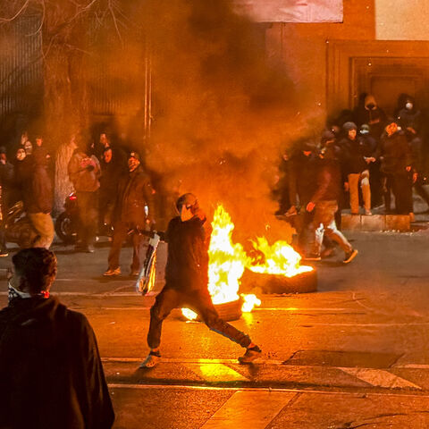 Iranians gather while blocking a street during a protest in Tehran, Iran on Jan. 9, 2026.