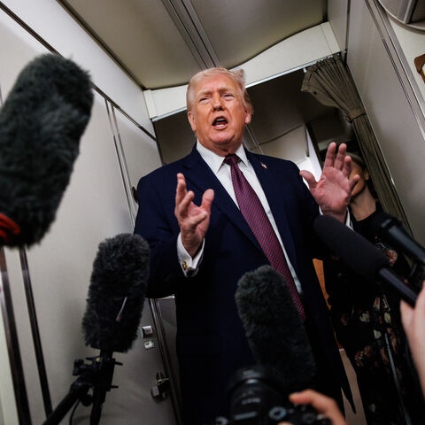 IN FLIGHT - JANUARY 11: U.S. President Donald Trump takes questions from the members of the press aboard Air Force One on January 11, 2026 en route back to the White House from Palm Beach, Florida. The President spent the weekend at his private club Mar-a-Lago in Palm Beach, Florida. (Photo by Samuel Corum/Getty Images)