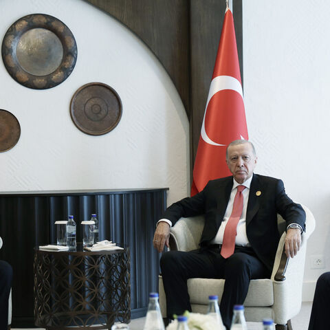 Turkish President Recep Tayyip Erdogan meets with Iranian President Masoud Pezeshkian as they attend the 17th Summit of the Economic Cooperation Organization in Khankendi, Azerbaijan on July 4, 2025.