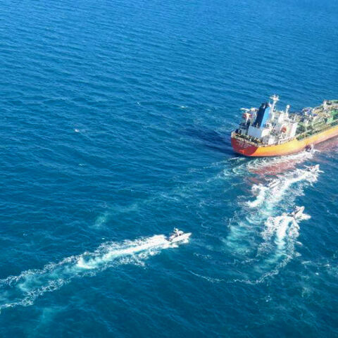 A picture obtained by AFP from the Iranian news agency Tasnim on Jan. 4, 2021, shows the South Korean-flagged tanker being escorted by Iran's Revolutionary Guards navy after being seized in the Gulf.