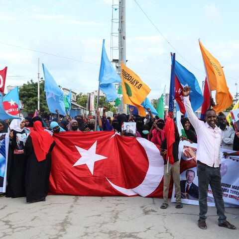 Somalis celebrate the victory of Turkish President Recep Tayyip Erdogan after he won the presidential run-off election during the celebration organised by the government in Mogadishu, on May 29, 2023. (Photo by Hassan Ali Elmi / AFP) (Photo by HASSAN ALI ELMI/AFP via Getty Images)