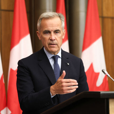 Canadian Prime Minister Mark Carney speaks during a press conference after a Cabinet meeting to discuss both trade negotiations with the US and the situation in the Middle East, at the National Press Theatre in Ottawa, Ontario, Canada on July 30, 2025. Canada "intends" to recognize a Palestinian state at the UN General Assembly in September, Prime Minister Mark Carney said Wednesday, a dramatic policy shift he said was necessary to preserve hopes of a two-state solution. (Photo by Dave CHAN / AFP) (Photo by