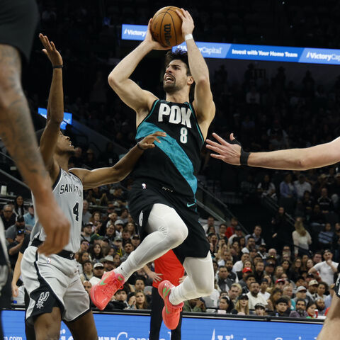 SAN ANTONIO, TX - JANUARY 03: Deni Avdija #8 of the Portland Trailblazers drives over the San Antonio Spurs in the second half at Frost Bank Center on January 3, 2026 in San Antonio, Texas. NOTE TO USER: User expressly acknowledges and agrees that, by downloading and or using this photograph, User is consenting to terms and conditions of the Getty Images License Agreement. (Photo by Ronald Cortes/Getty Images)