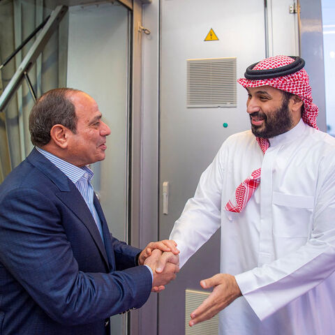 This handout picture released by the Saudi Press Agency (SPA) on February 23, 2026, shows Saudi Crown Prince Mohammed bin Salman (R) welcoming Egypt's President Abdel Fattah El-Sisi (L) upon his arrival for an official visit at King Abdulaziz International Airport in Jeddah. (Photo by Ahmed NURELDINE / SPA / AFP via Getty Images)