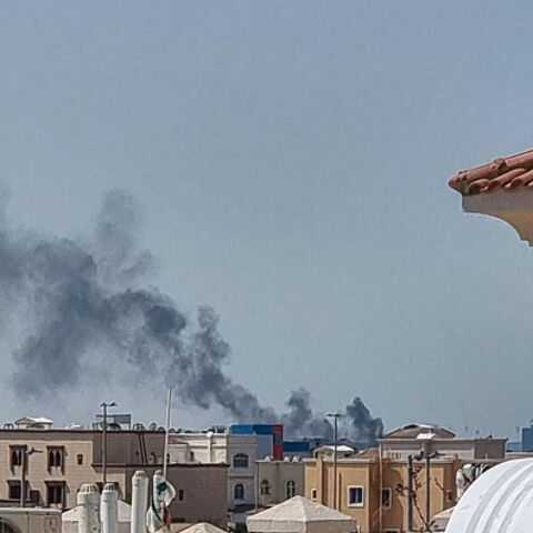A smoke plume rises over Abu Dhabi from the site of an Iranian missile strike on February 28, 2026. Iranian missiles hit capital cities around the wealthy Gulf on February 28, killing at least one, in retaliation for a US and Israeli attack that threatened to spark a wider conflict. One civilian died in Abu Dhabi, capital of the United Arab Emirates, after being struck by falling debris, according to the ministry of defence. (Photo by AFP via Getty Images)