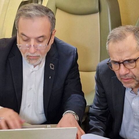 Iranian Foreign Minister Abbas Araghchi (L) and Deputy Foreign Minister for Political Affairs Majid Takht-Ravanchi on a flight to Muscat, Oman, to participate in talks with the US over Tehran's nuclear program, Feb. 5, 2026. 