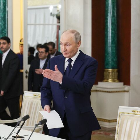 In this pool photograph distributed by the Russian state agency Sputnik, Russia's Russian President Vladimir Putin and Iranian President Masoud Pezeshkian arrive for a documents signing ceremony following their talks at the Kremlin in Moscow on January 17, 2025. (Photo by Vyacheslav PROKOFYEV / POOL / AFP) (Photo by VYACHESLAV PROKOFYEV/POOL/AFP via Getty Images)
