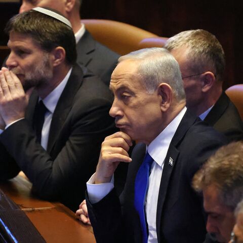 Israel's Prime Minister Benjamin Netanyahu (C) listens to a speech by his Indian counterpart Narendra Modi at the Israeli parliament, the Knesset, Jerusalem, Feb. 25, 2026.