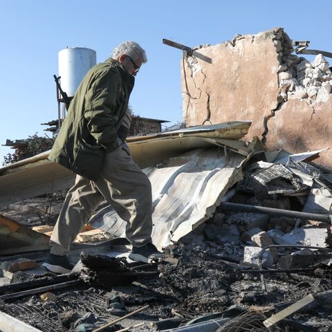 An Iranian Kurdish peshmerga member of the Kurdistan Democratic Party of Iran inspects the damage sustained at the Azadi Camp following an Iranian cross-border attack in the town of Koye, east of Erbil district, on March 3, 2026. 