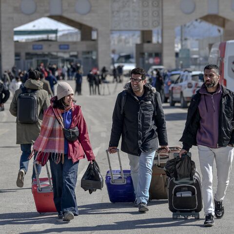 Iranian nationals arrive in Turkey after passing through the Razi-Kapikoy border crossing in Van, northeastern Turkey, on March 3, 2026.