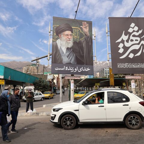 A large banner with the image of Iran's slain supreme leader Ayatollah Ali Khamenei adorns a main taxi rank close to Tajrish Square, one week on from the start of the US-Israel attack on Iran, in Tehran on March 7, 2026. 