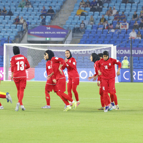 This photo taken on March 8, 2026 shows Iranian players running towards their positions at the start of the AFC Women's Asian Cup Australia 2026 football match between Iran and the Philippines on the Gold Coast. 