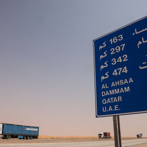 Lorries roll along the highway between Riyadh and al-Ahsa, some 200 kilometers east of the Saudi capital, on March 15, 2026. The war sparked by US-Israel strikes on Iran on February 28 has sparked chaos on global markets, and sent the price of oil soaring after the Islamic republic imposed control by force over the crucial artery. (Photo by Fayez NURELDINE / AFP via Getty Images) /