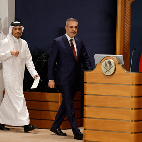 Turkey's Foreign Minister Hakan Fidan (R) and Qatar's Prime Minister and Foreign Minister Sheikh Mohammed bin Abdulrahman Al Thani (2L) arrive to address a joint press conference in Doha on March 19, 2026. (Photo by Karim JAAFAR / AFP via Getty Images)