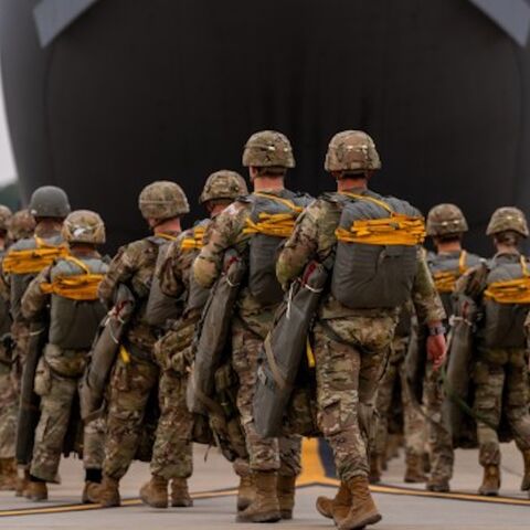 Paratroopers assigned to the 82nd Airborne Division walk to a C-17 Globemaster III before an airborne operation at Fort Bragg, North Carolina, March 13, 2025.