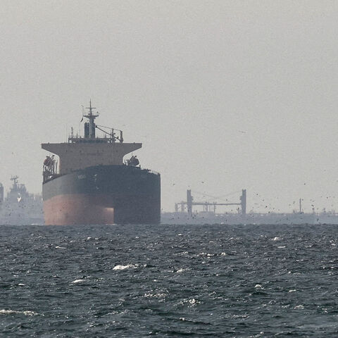 FILE PHOTO: Cargo ships in the Gulf, near the Strait of Hormuz, as seen from northern Ras al-Khaimah, near the border with Oman’s Musandam governance, amid the U.S.-Israeli conflict with Iran, in United Arab Emirates, March 11, 2026. REUTERS/Stringer/File Photo