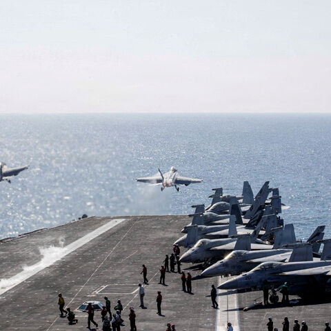 FILE PHOTO: Two F/A-18 Super Hornets launch from the flight deck of the U.S. Navy Nimitz-class aircraft carrier USS Abraham Lincoln in support of the Operation Epic Fury attack on Iran from an undisclosed location March 3, 2026. U.S. Navy/Handout via REUTERS  THIS IMAGE HAS BEEN SUPPLIED BY A THIRD PARTY/File Photo