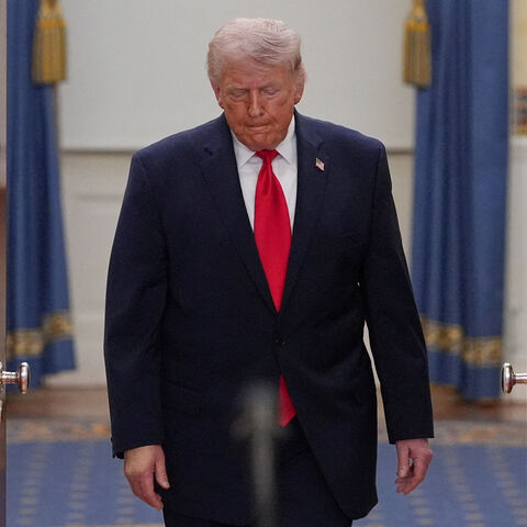 FILE PHOTO: President Donald Trump arrives to speak about the Iran war from the Cross Hall of the White House on Wednesday, April 1, 2026, in Washington.     Alex Brandon/Pool via REUTERS/File Photo
