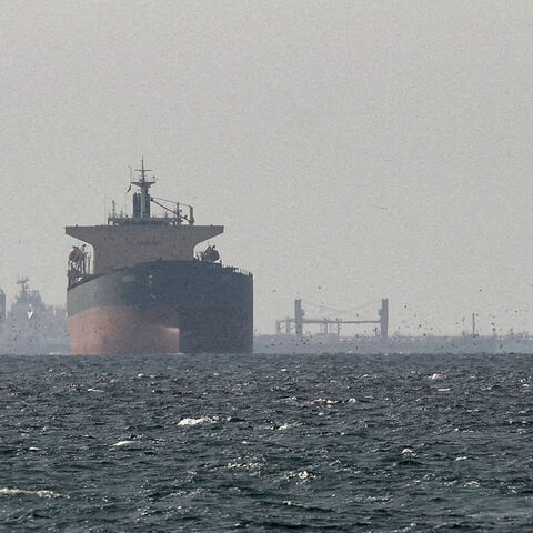 FILE PHOTO: Cargo ships in the Gulf, near the Strait of Hormuz, as seen from northern Ras al-Khaimah, near the border with Oman’s Musandam governance, amid the U.S.-Israeli conflict with Iran, in United Arab Emirates, March 11, 2026. REUTERS/Stringer/File Photo