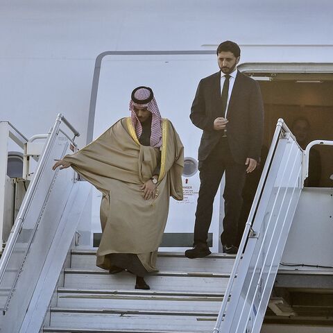 Saudi Arabia's Foreign Minister Faisal bin Farhan (L) disembarks from an airplane upon his arrival at the Rafic Hariri International Airport in Beirut on Jan. 23, 2025. 