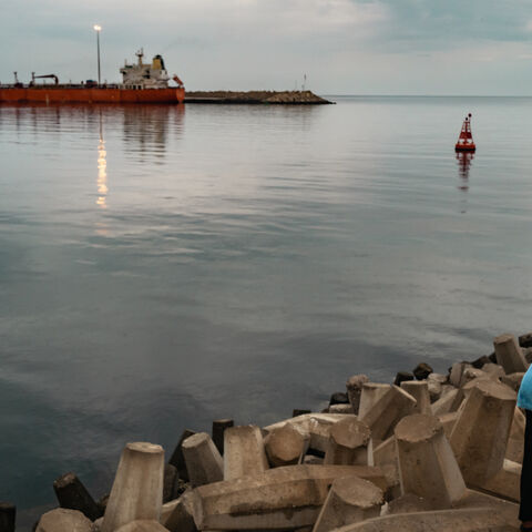 A bulk carrier sits anchored at Sultan Qaboos Port on March 23, 2026 in Muscat, Oman. 