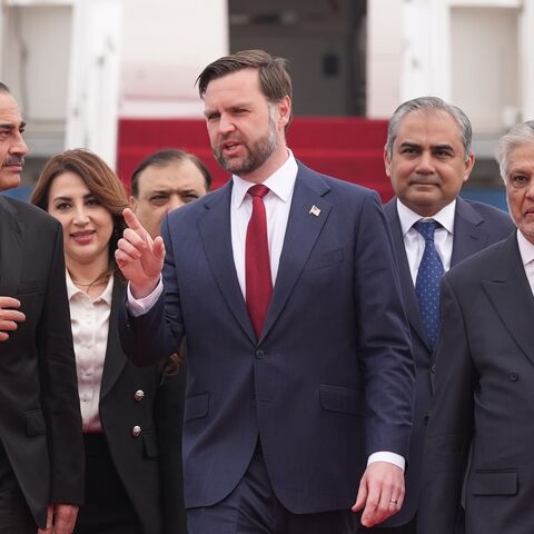US Vice President JD Vance (C) walks with Pakistan's Chief of Defense Forces and Chief of Army Staff Field Marshall Asim Munir (L), and Pakistani Deputy Prime Minister and Foreign Minister Mohammad Ishaq Dar after arriving for talks with Iranian officials on April 11, 2026, in Islamabad, Pakistan. 
