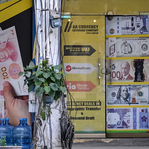 A security personnel sits in a market after markets reopened in Islamabad on April 23, 2026, following heightened security measures amid the ongoing US-Iran peace talks.