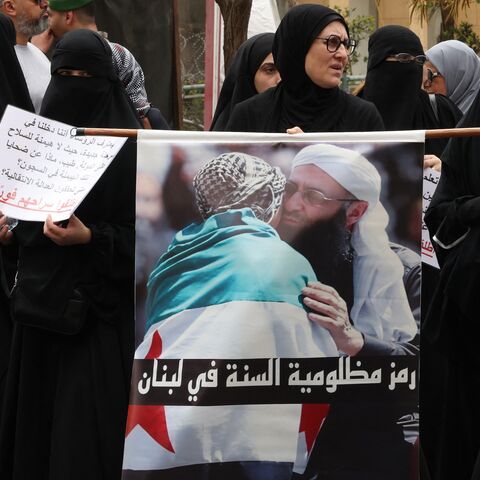 Women hold portraits of jailed Islamist cleric Sheikh Ahmad al-Assir during a protest calling for his release in Beirut on April 24, 2025.