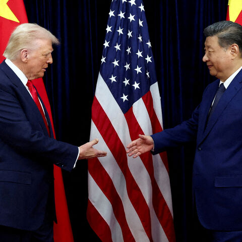 FILE PHOTO: FILE PHOTO: U.S. President Donald Trump shakes hands with Chinese President Xi Jinping as they hold a bilateral meeting at Gimhae International Airport, on the sidelines of the Asia-Pacific Economic Cooperation (APEC) summit, in Busan, South Korea, October 30, 2025. REUTERS/Evelyn Hockstein/File Photo/File Photo