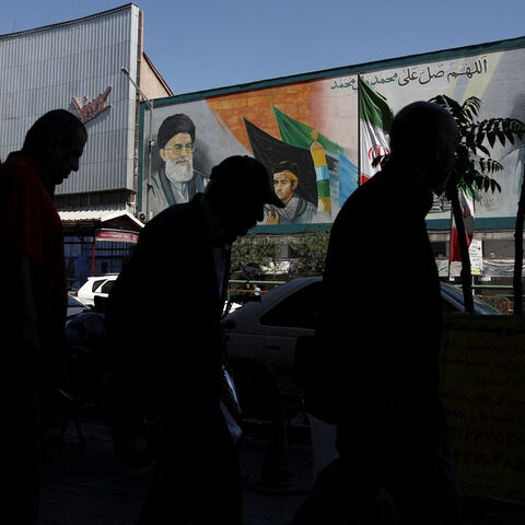 People walk past a mural depicting the late leader of the Islamic Revolution, Ayatollah Ruhollah Khomeini, and Iran's late Supreme Leader Ayatollah Ali Khamenei, in Tehran, Iran, May 25, 2026. Majid Asgaripour/WANA (West Asia News Agency) via REUTERS
