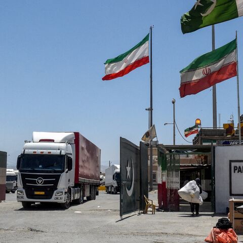 Iranian cargo trucks cross into the Pakistan-Iran border at Taftan, Balochistan province, on June 18, 2025, amid the ongoing conflict between Israel and Iran.