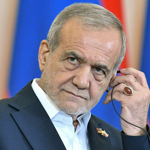 Iranian President Masoud Pezeshkian listens during a joint press conference alongside Armenia's prime minister in Yerevan on Aug. 19, 2025. 