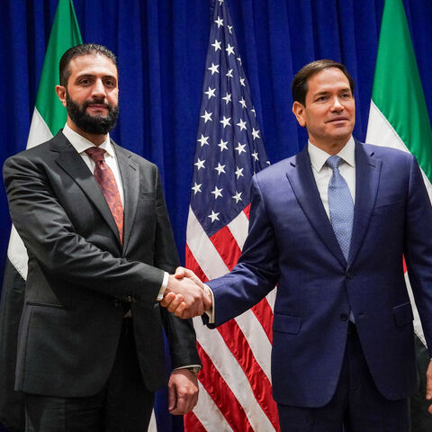 TOPSHOT - US Secretary of State Marco Rubio (R) meets with Syrian President Ahmed al-Sharaa at the Lotte New York Palace Hotel on the sidelines of the United Nations General Assembly meeting in New York City on September 22, 2025. (Photo by Bing Guan / POOL / AFP via Getty Images)