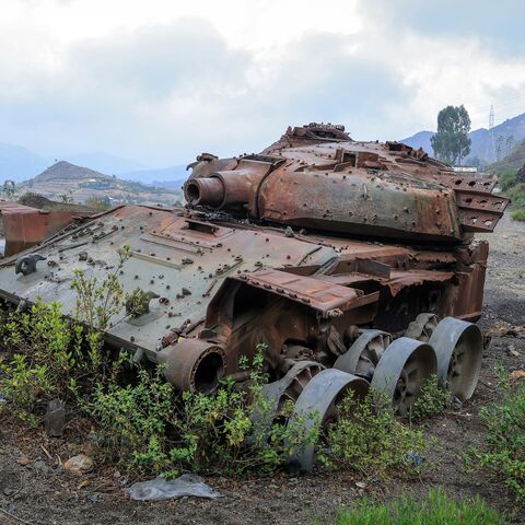 The charred remains of a tank from clashes between the Ethiopian National Defense Force (ENDF) and the Tigray People's Liberation Front (TPLF) lie on a road near Gereb Agew, Southern Tigray, on March 3, 2026.