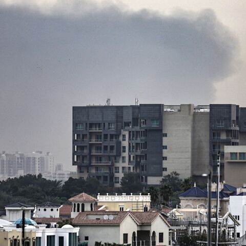 Explosions rattled buildings in Dubai and a large cloud of smoke hung over a central area of the Middle East financial hub on March 13, 2026.
