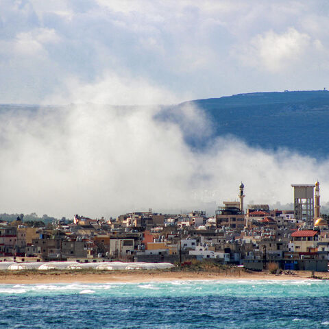 Smoke rises following Israeli bombardment on the village of Qlaile as pictured from nearby Tyre in southern Lebanon on April 7, 2026. The Israeli military said on April 7 that it had completed the deployment of ground troops along a "defence line" in southern Lebanon, where it is fighting Iran-backed Hezbollah. The military has not given any geographical details on the furthest point to which its soldiers have advanced into Lebanese territory. (Photo by Kawnat Haju/AFP via Getty Images)