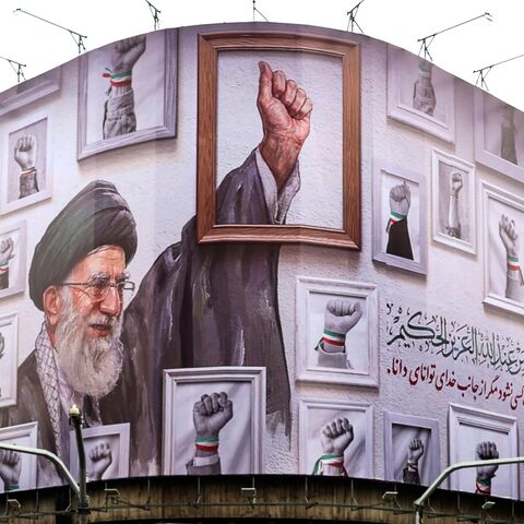 A billboard with the image of the late Iranian supreme leader Ayatollah Ali Khamenei wraps the front of a building in Tehran on May 5, 2026. 