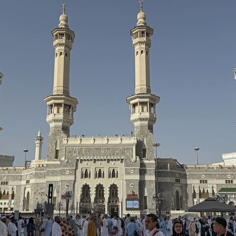 Muslim worshippers walk along the Grand Mosque complex in the holy city of Mecca on May 22, 2026, ahead of the annual Hajj pilgrimage. 