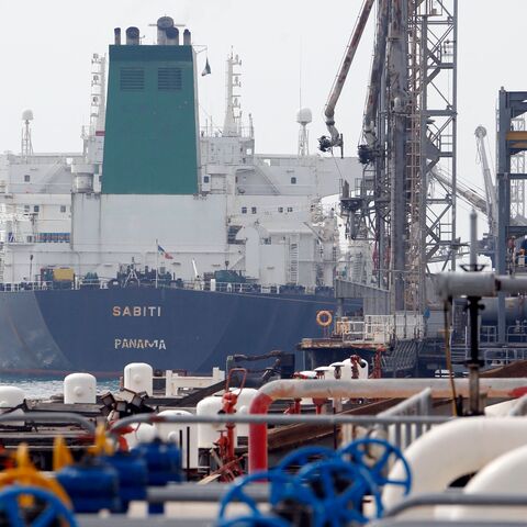 A picture taken on March 12, 2017, shows an Panamanian tanker docking at the platform of the oil facility in the Khark Island, on the shore of the Gulf. 