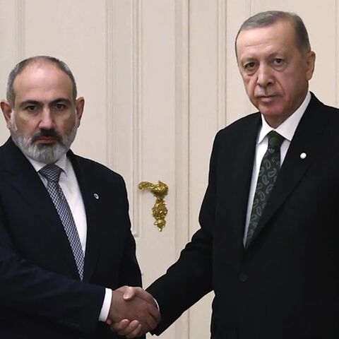 Turkey’s President Recep Tayyip Erdogan, right, and Armenia’s Prime Minister Nikol Pashinyan shake hands before a meeting at Prague Castle in Prague, Czech Republic, Thursday, Oct. 6, 2022.