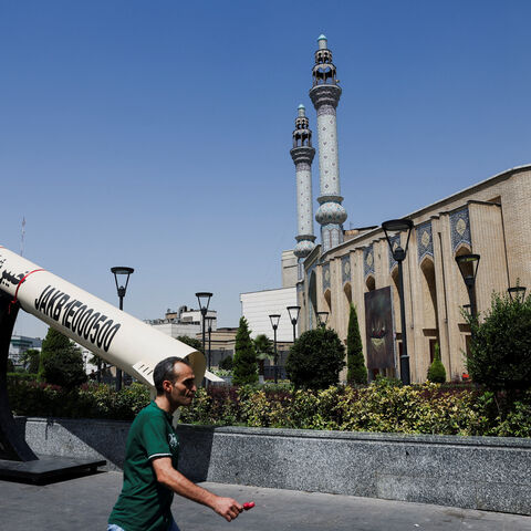 A man walks next to a symbolic mock-up of an Iranian missile, on a street in Tehran, Iran, June 11, 2026. Majid Asgaripour/WANA (West Asia News Agency) via REUTERS